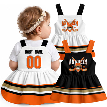 Personalized Anaheim hockey baby suspender dress shown on baby with Black and White city-color styles