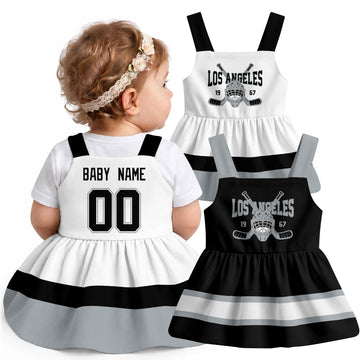 Personalized Los Angeles hockey baby suspender dress shown on baby with Black and White city-color styles