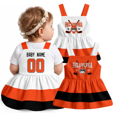 Personalized Philadelphia hockey baby suspender dress shown on baby with Orange and White city-color styles