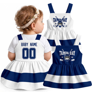 Personalized Tampa Bay hockey baby suspender dress shown on baby with Blue and White city-color styles