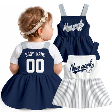 New York-inspired baseball baby strap dress modeled in Navy, with Navy and White front designs shown