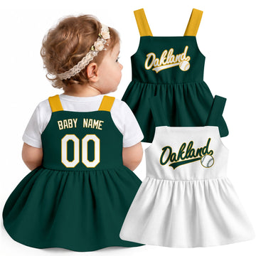 Oakland-inspired baseball baby strap dress modeled in Green, with Green and White front designs shown