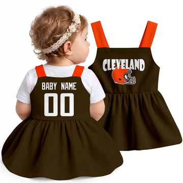 Personalized Cleveland football baby suspender dress shown on baby in Brown city-color style