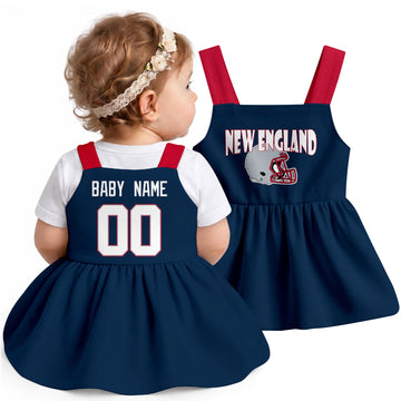 Personalized New England football baby suspender dress shown on baby in Navy city-color style