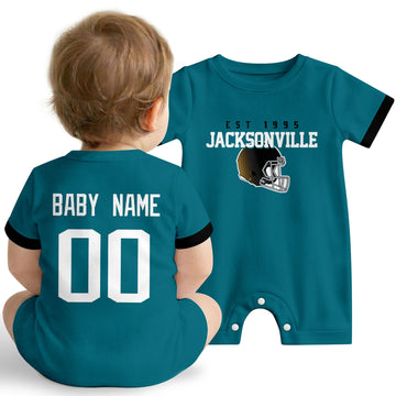 Baby wearing Jacksonville football-inspired personalized romper in teal, featuring custom name and number design with sporty varsity lettering and football helmet graphic