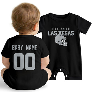 Baby wearing Las Vegas football-inspired personalized romper in black, featuring custom name and number design with sporty varsity lettering and football helmet graphic