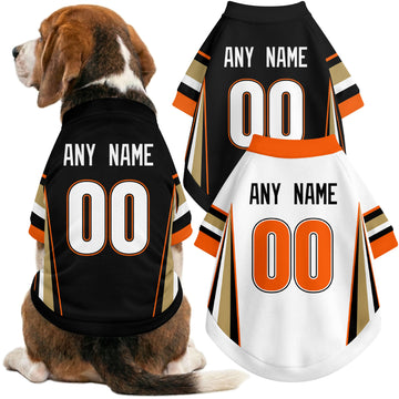 Dog wearing custom hockey-style jersey in Black and White colors with personalized name and number
