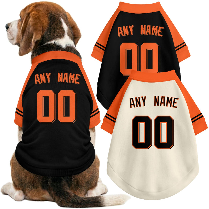 Dog wearing custom baseball-style jersey in Black and Cream colors with personalized name and number
