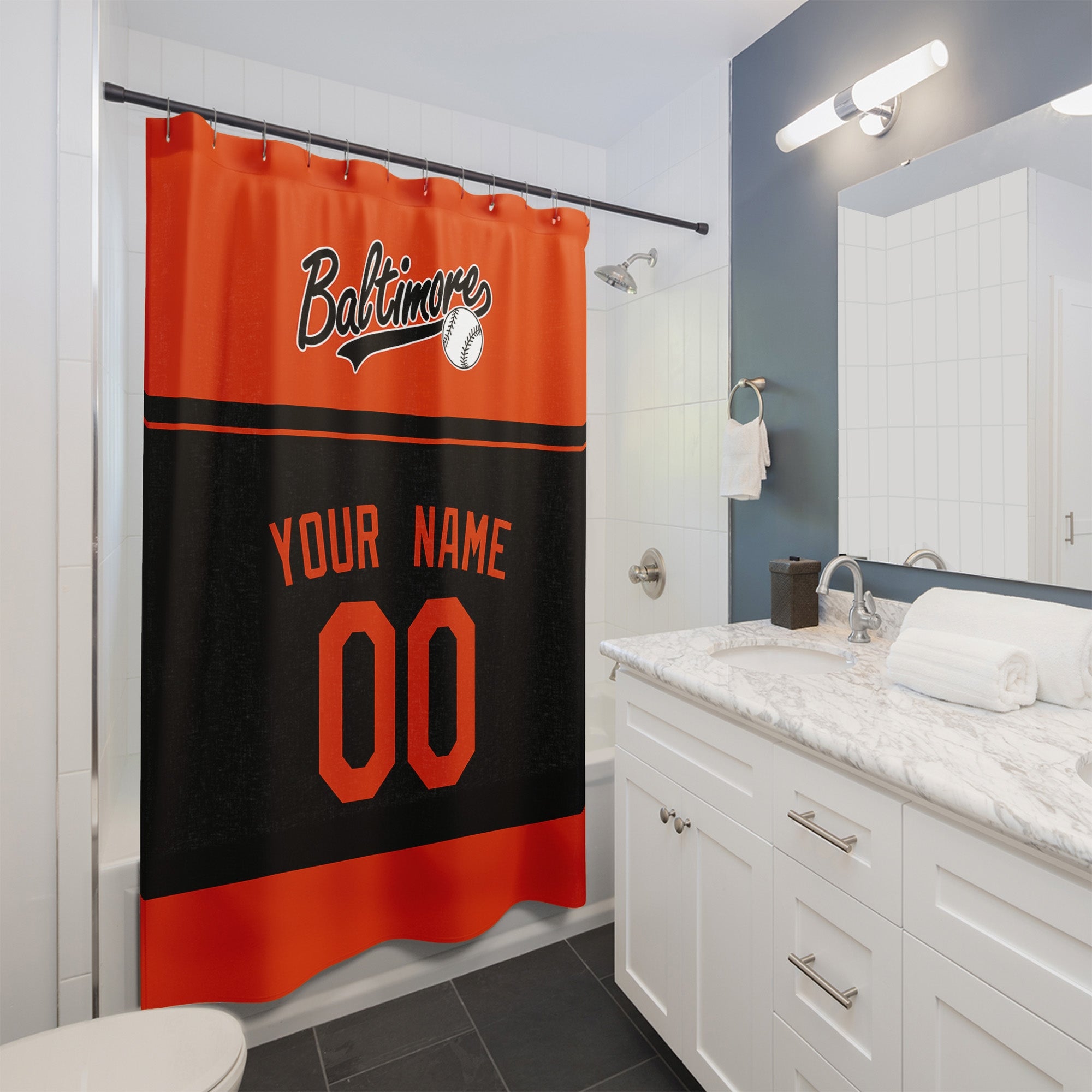 Personalized Baltimore baseball shower curtain in orange and black hanging in a modern bathroom with custom name and number