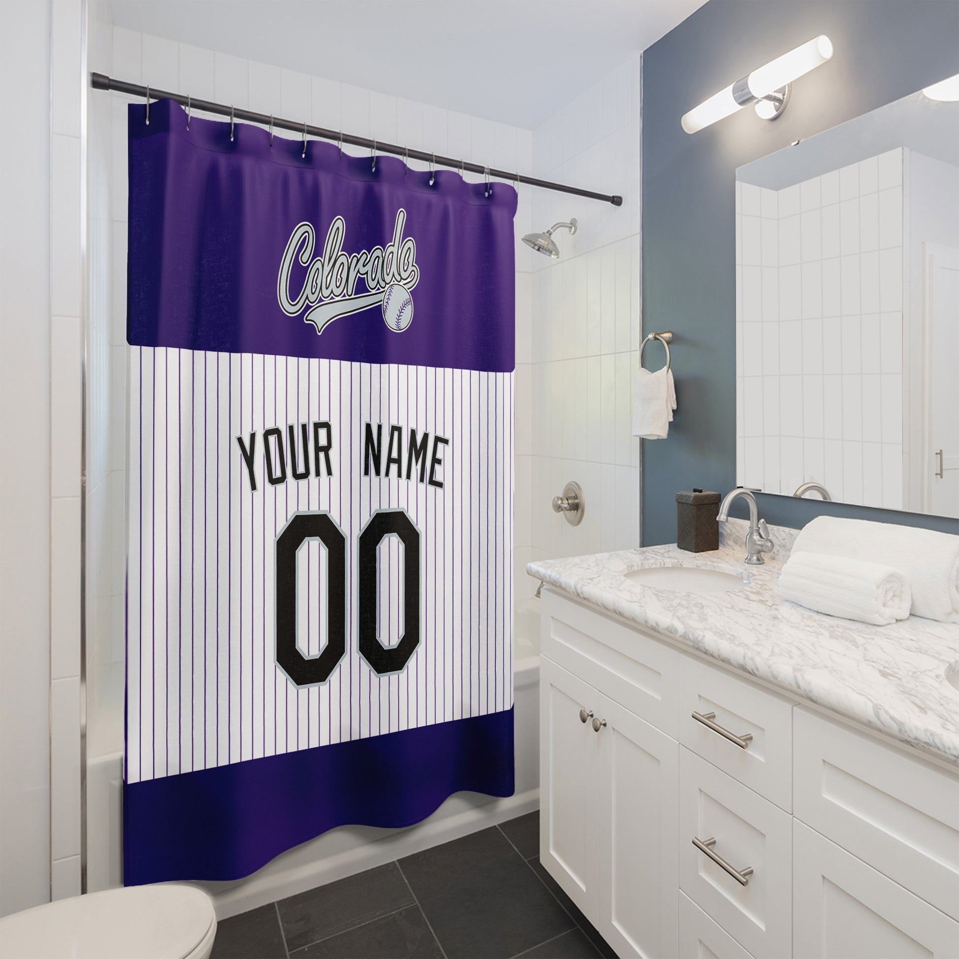Personalized Colorado baseball shower curtain in purple white and black hanging in a modern bathroom with custom name and number