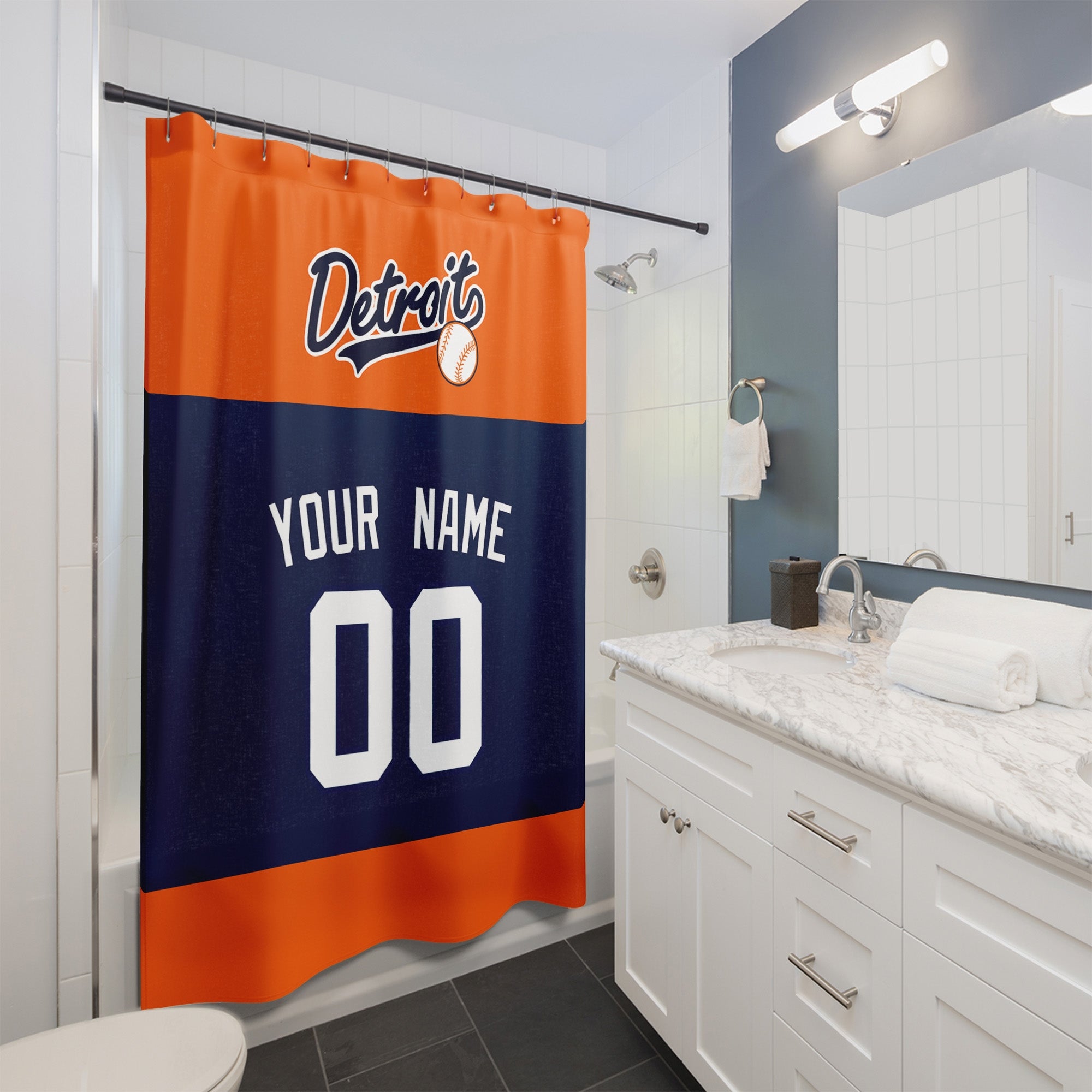 Personalized Detroit baseball shower curtain in orange navy and white hanging in a modern bathroom with custom name and number