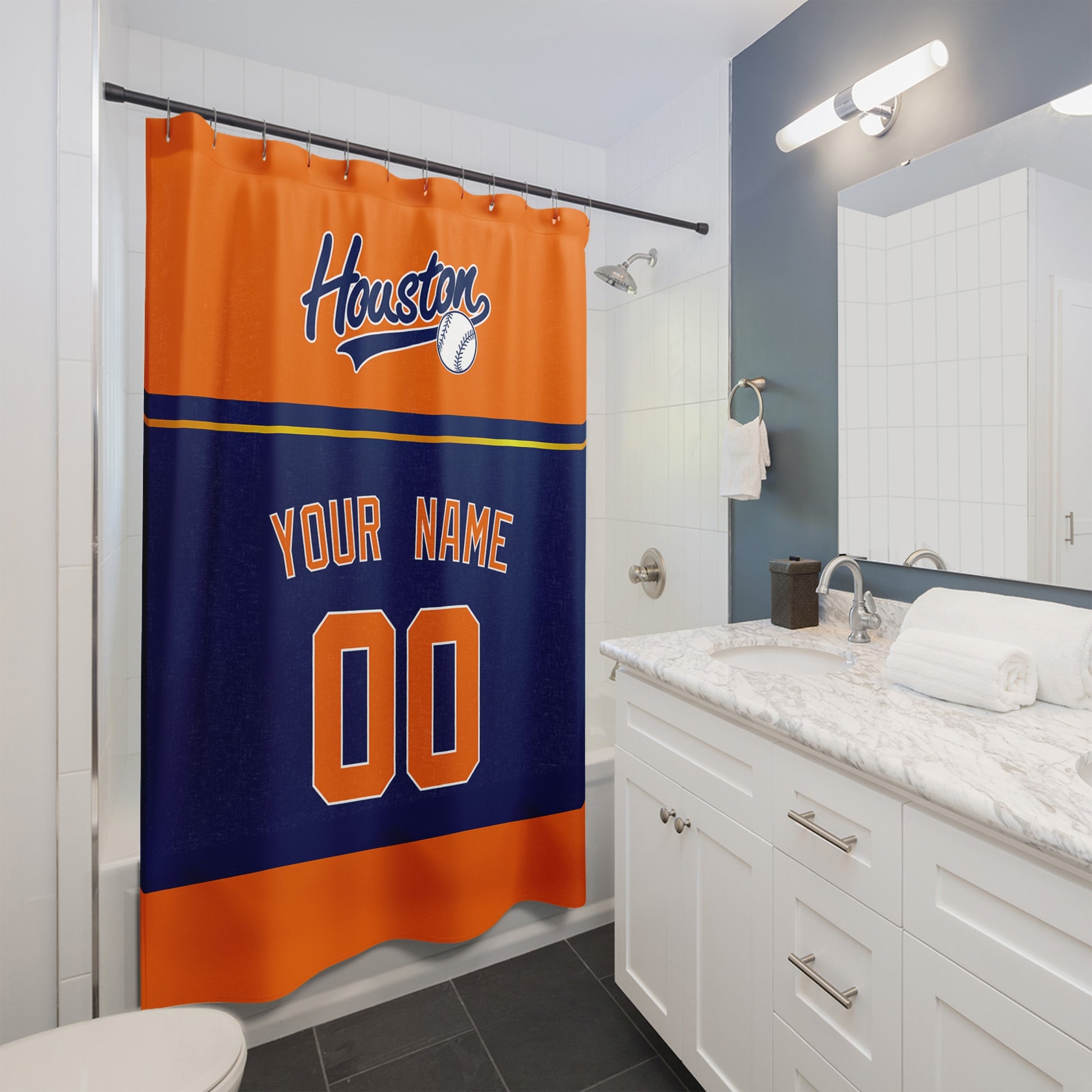 Personalized Houston baseball shower curtain in orange navy and blue hanging in a modern bathroom with custom name and number