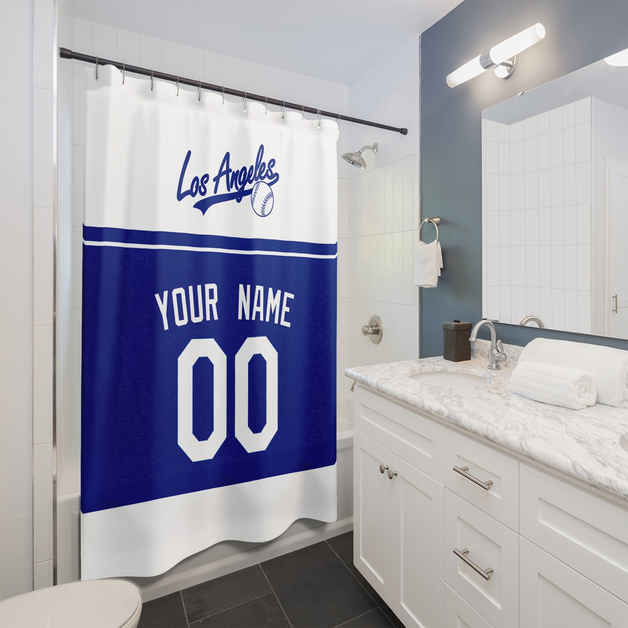 Personalized Los Angeles Blue baseball shower curtain in white royal blue and navy hanging in a modern bathroom with custom name and number