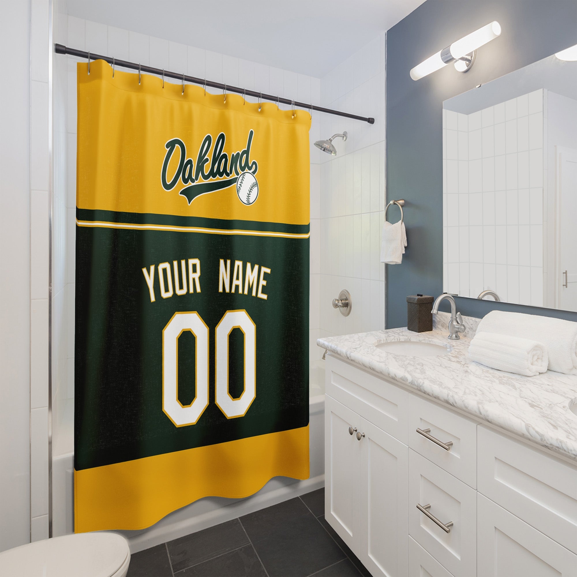 Personalized Oakland baseball shower curtain in gold green and white hanging in a modern bathroom with custom name and number