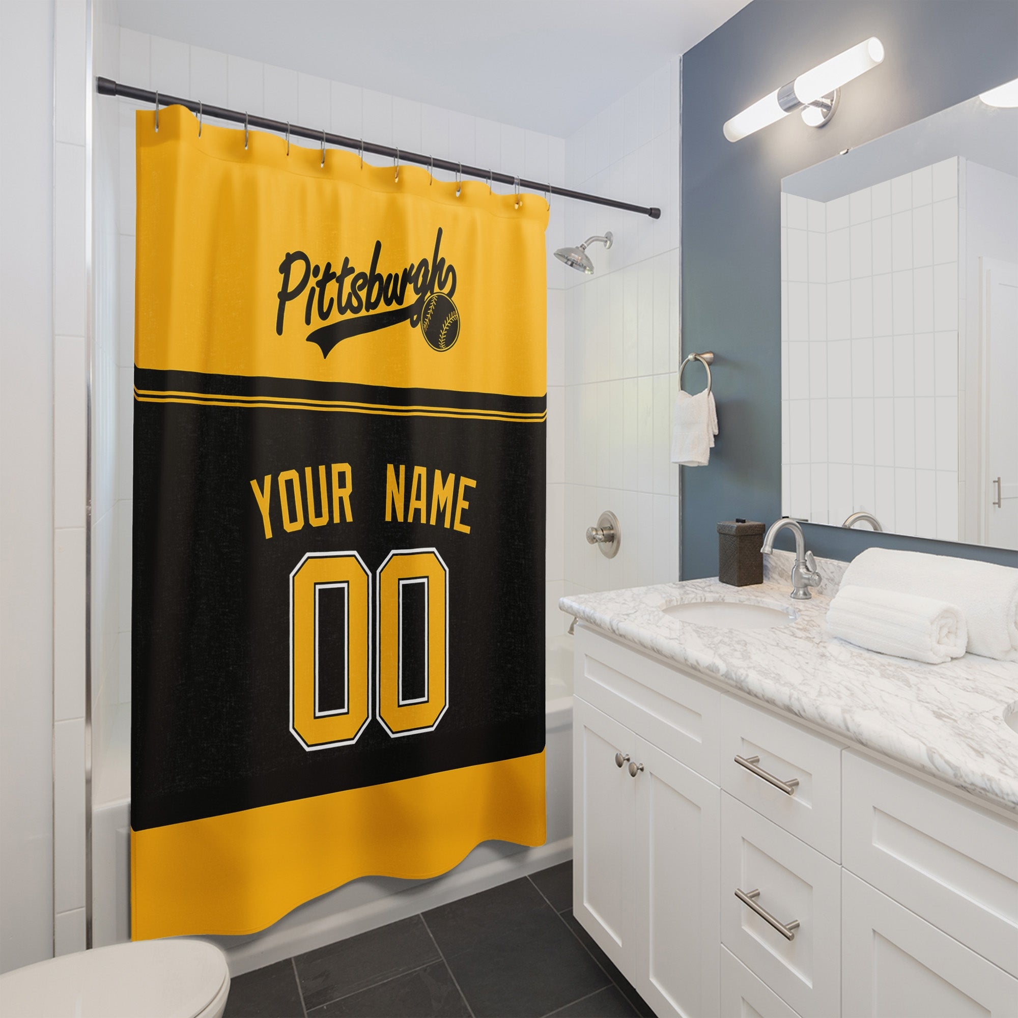 Personalized Pittsburgh baseball shower curtain in gold black and white hanging in a modern bathroom with custom name and number