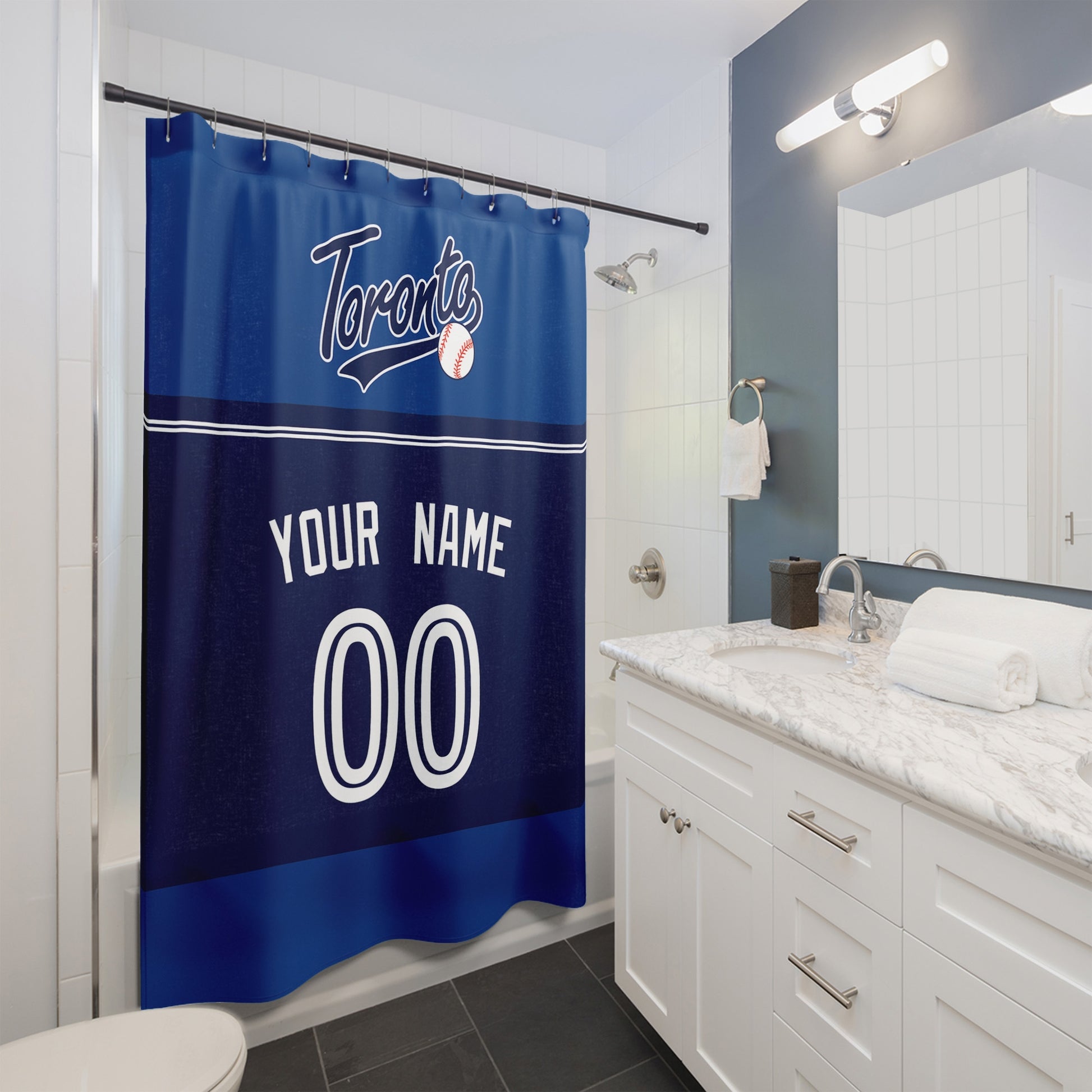 Personalized Toronto baseball shower curtain in royal blue navy and white hanging in a modern bathroom with custom name and number