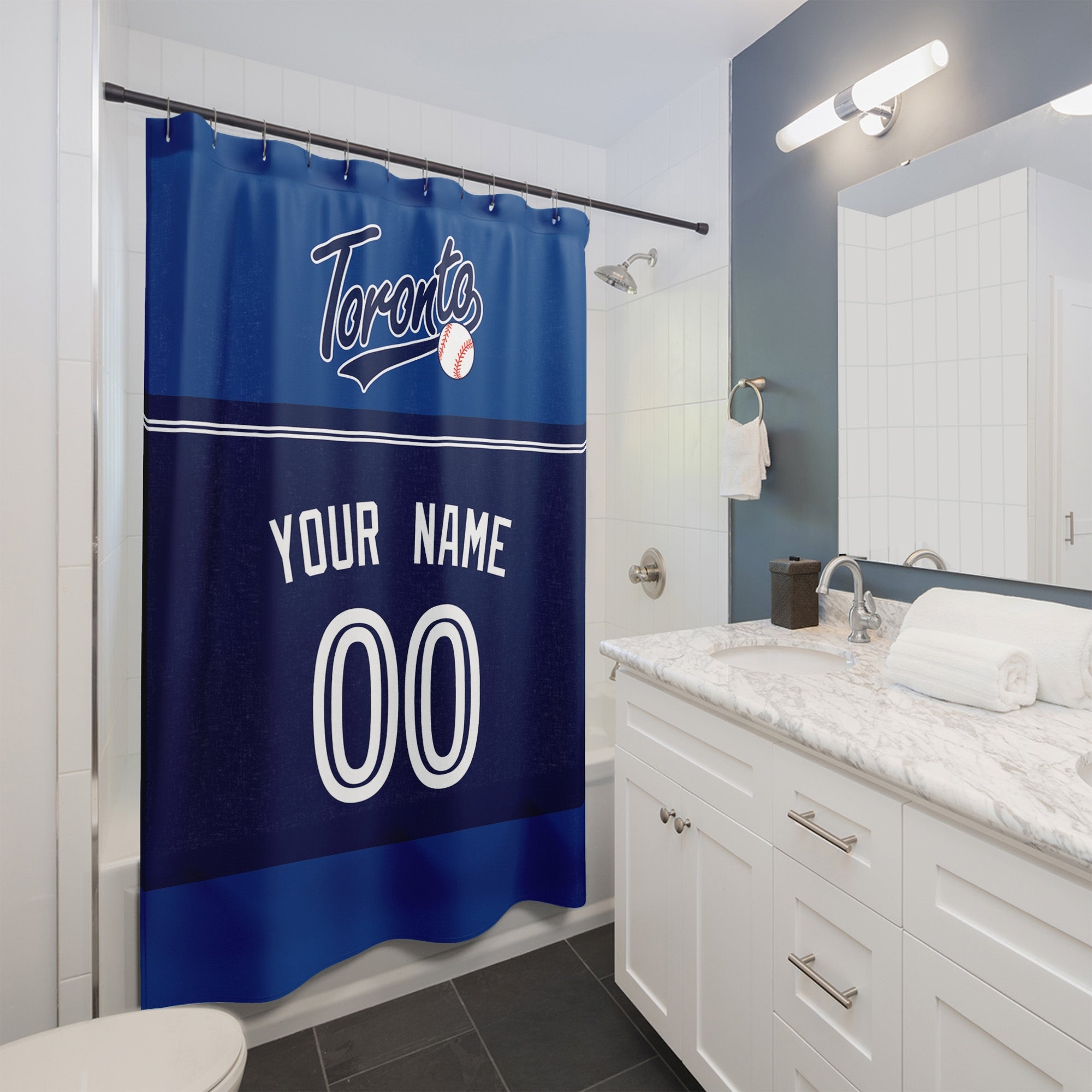 Personalized Toronto baseball shower curtain in royal blue navy and white hanging in a modern bathroom with custom name and number