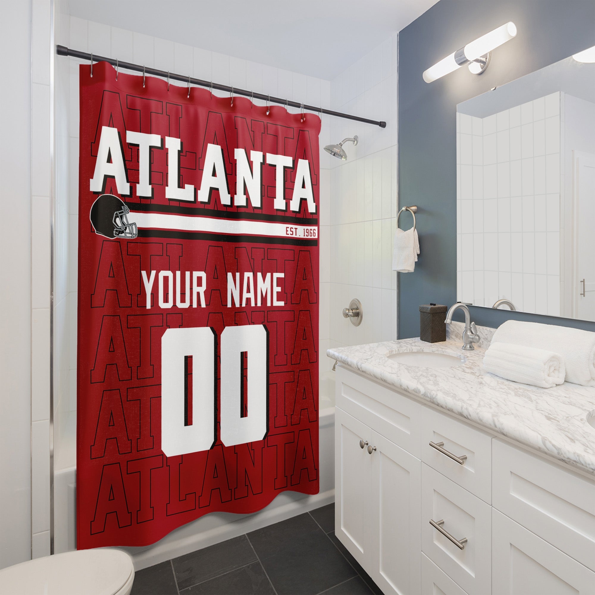 Personalized Atlanta football shower curtain with custom name and number hanging in a modern bathroom