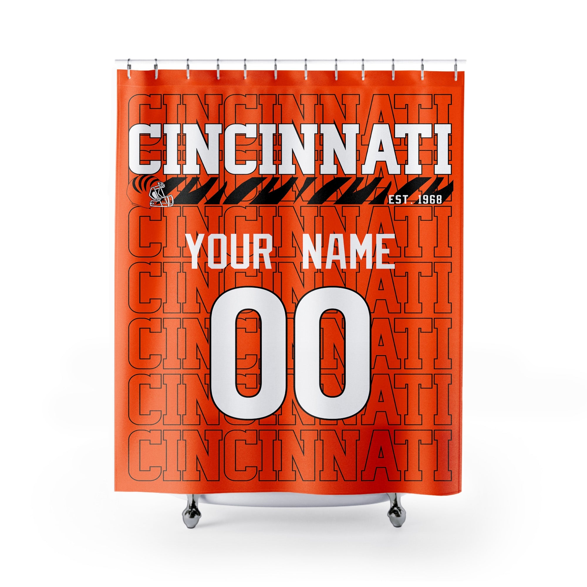 Personalized Cincinnati football shower curtain in orange black and white colors with custom name and number on a white background