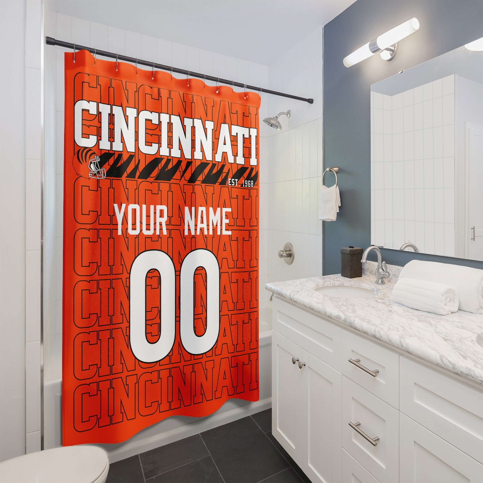 Personalized Cincinnati football shower curtain with custom name and number hanging in a modern bathroom