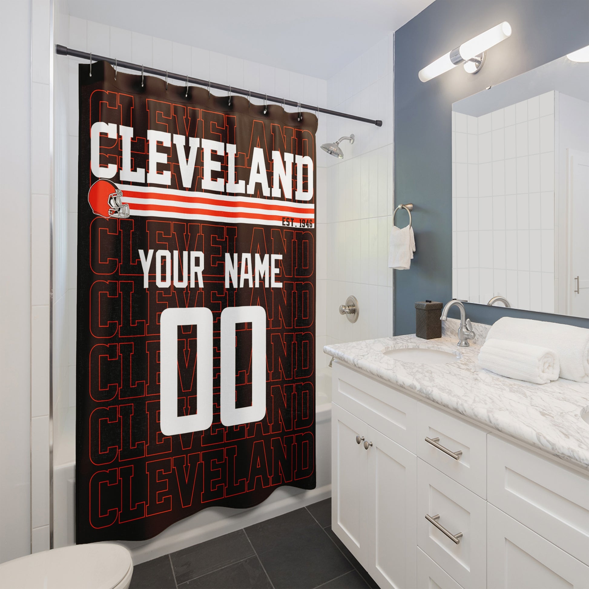 Personalized Cleveland football shower curtain with custom name and number hanging in a modern bathroom