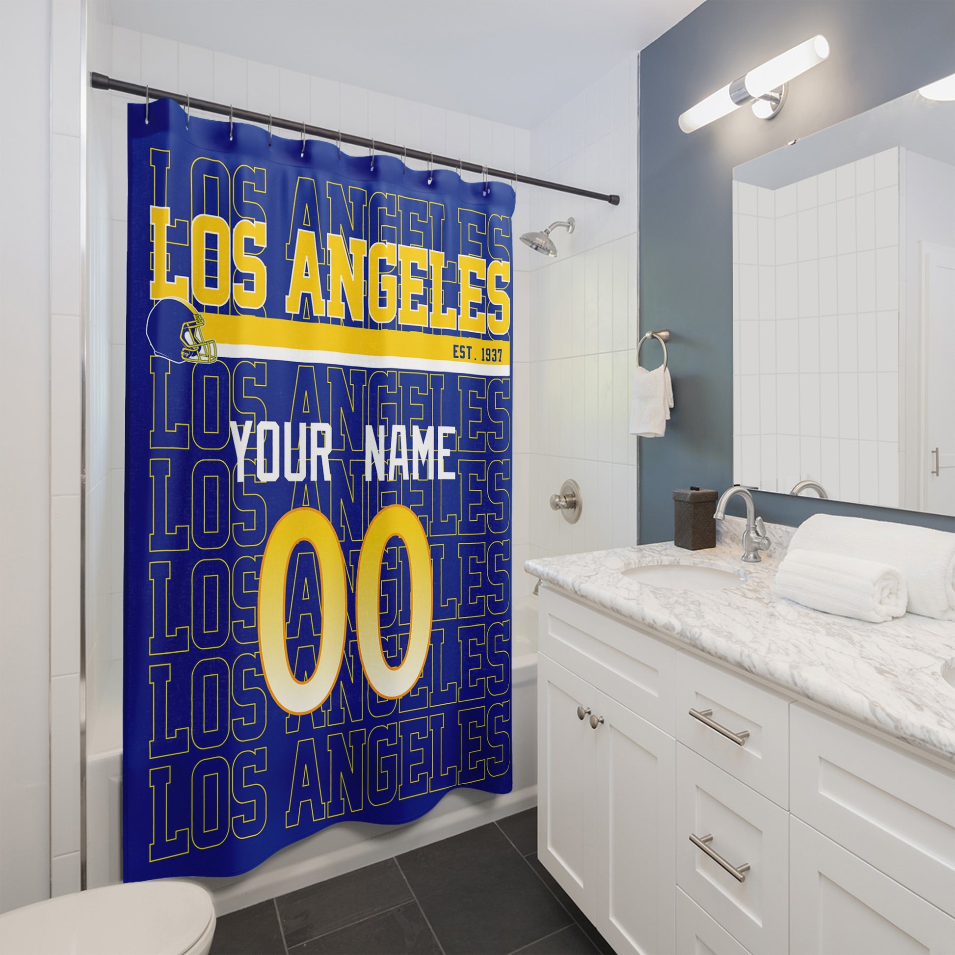 Personalized Los Angeles Navy and Gold football shower curtain with custom name and number hanging in a modern bathroom