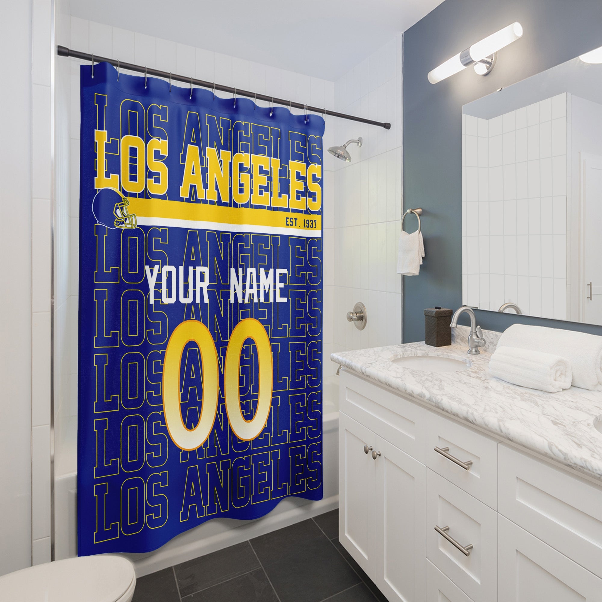 Personalized Los Angeles Navy and Gold football shower curtain with custom name and number hanging in a modern bathroom