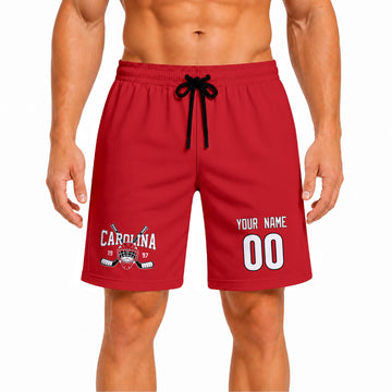 Red Carolina-inspired hockey athletic shorts front view worn by male model, showcasing custom name, number, and team graphic