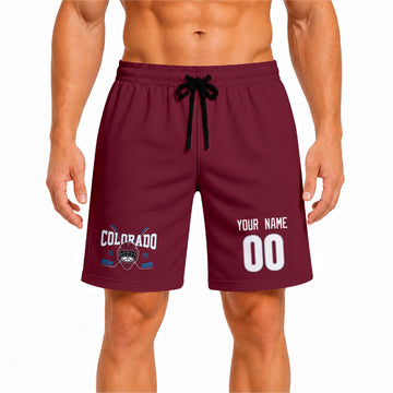 Burgundy Colorado-inspired hockey athletic shorts front view worn by male model, showcasing custom name, number, and team graphic