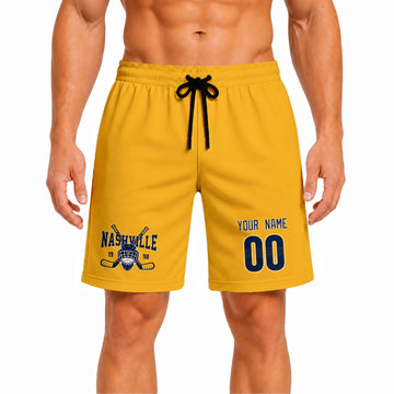 Gold Nashville-inspired hockey athletic shorts front view worn by male model, showcasing custom name, number, and team graphic