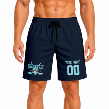 Blue Seattle-inspired hockey athletic shorts front view worn by male model, showcasing custom name, number, and team graphic